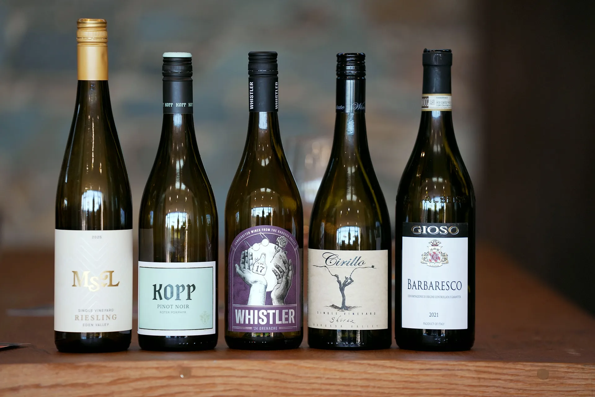 The five Round 1 bottles lined up with their labels facing out: Ms. L Riesling, Kopp Pinot Noir, Whistler Grenache, Cirillo Shiraz and Gioso Barbaresco.